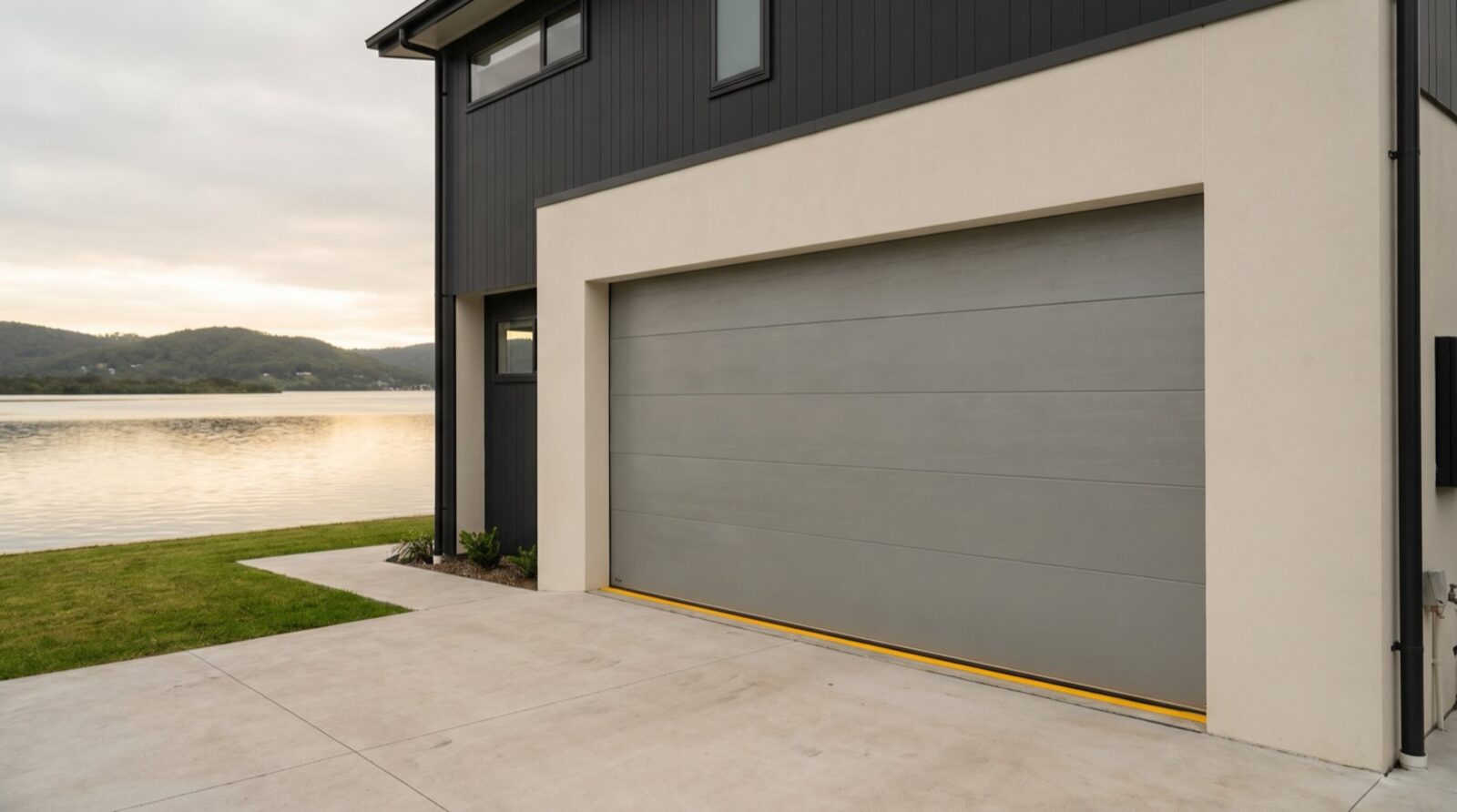 A clean modern sectional garage door on a contemporary Gosford waterfront home